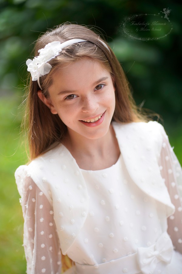 Kommunionkind mit Jacke. Vielen Dank.